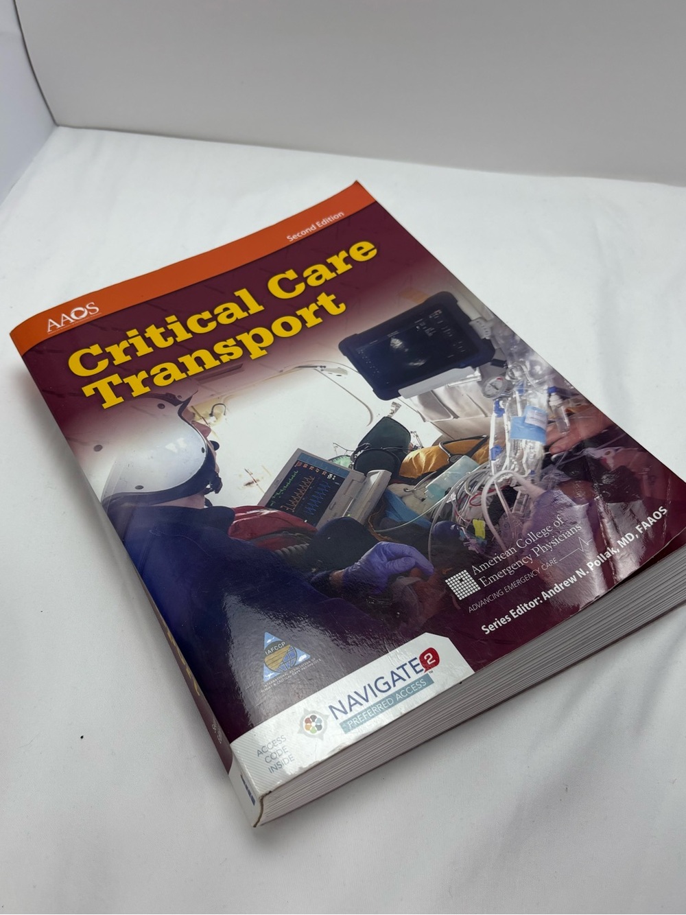 AAOS Critical Care Transport Textbook - Burgundy and Orange Cover